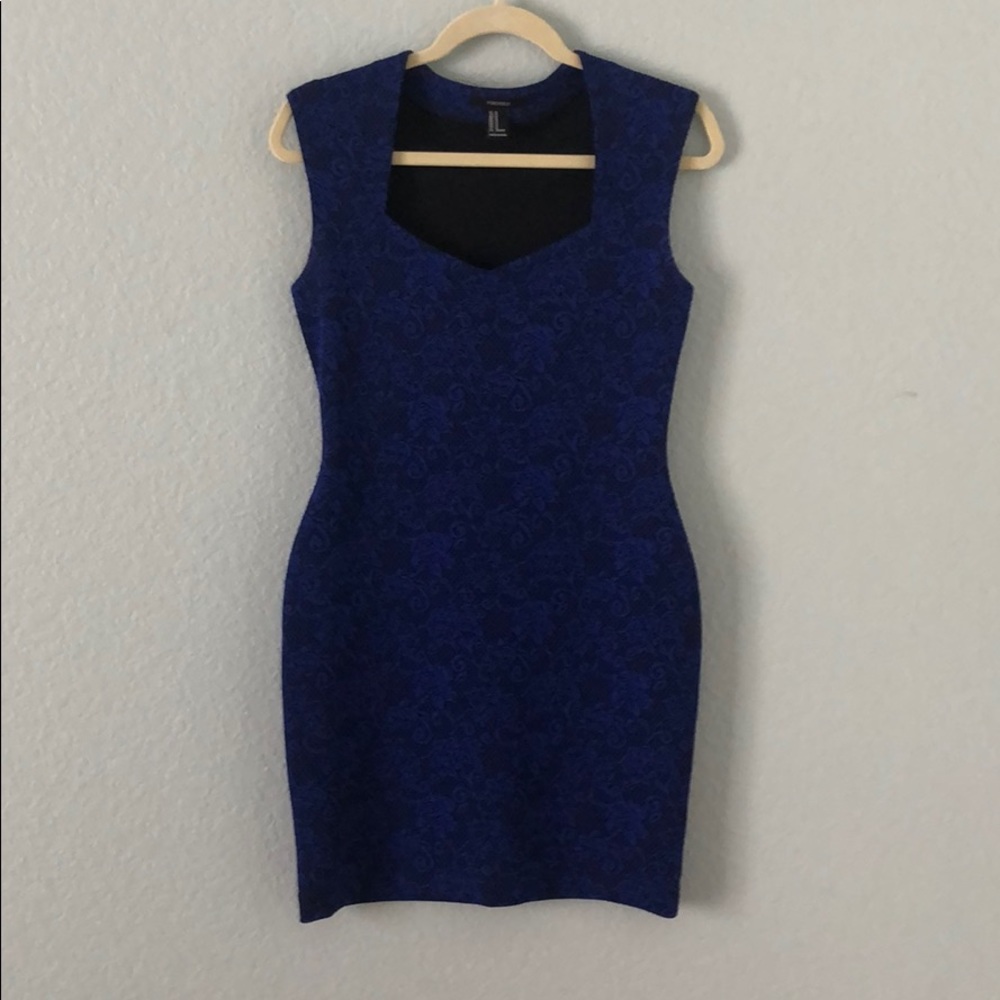 Body flattering dress. Black & blue floral pattern